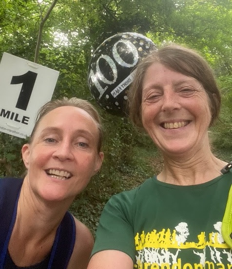Di and Fran smiling, with one mile to go in the race