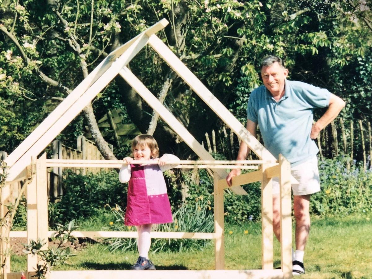 Ellie with her grandad on a play area
